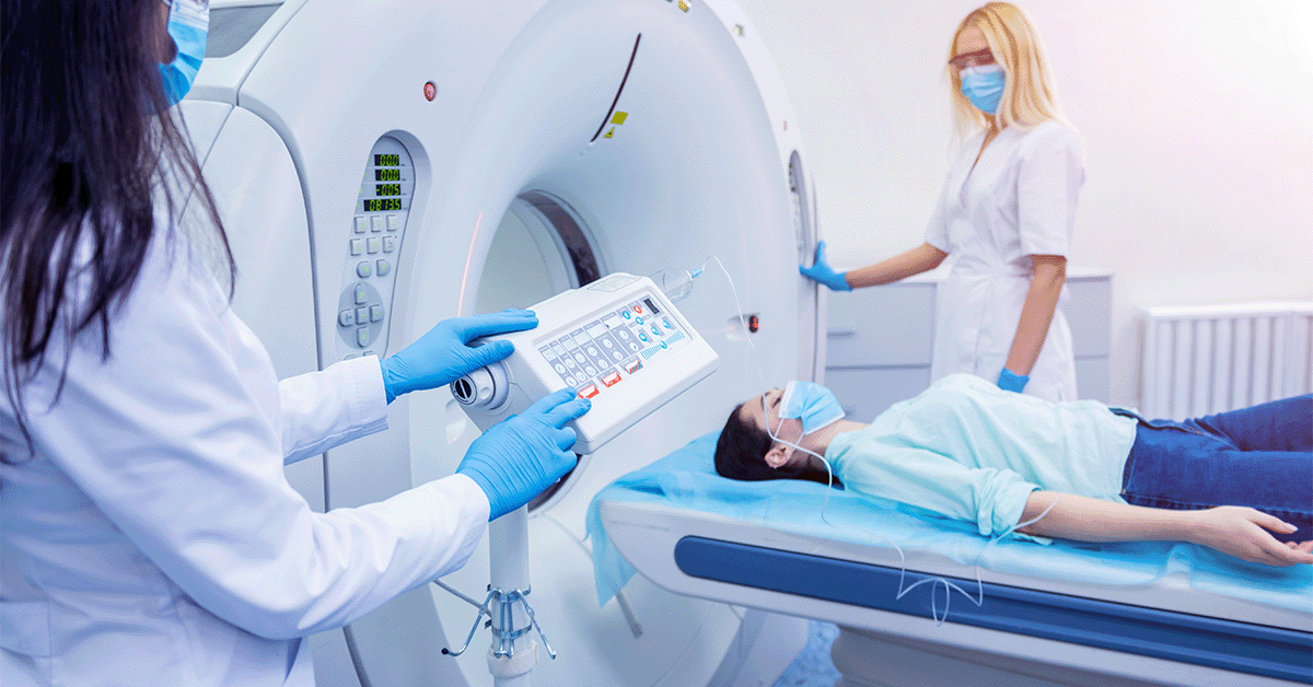 Person going through a CT machine