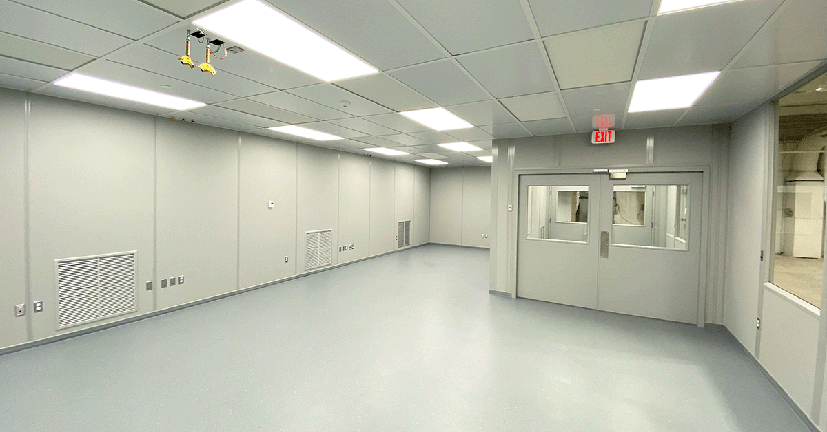 Inside of a cleanroom with modular wall panels and an epoxy floor