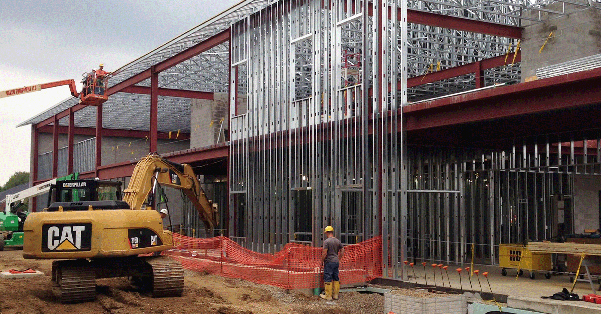 Outside of a large grocery commercial building that is being built