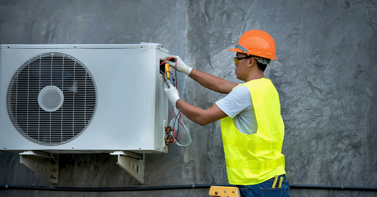 HVAC Maintenance technician working on unit