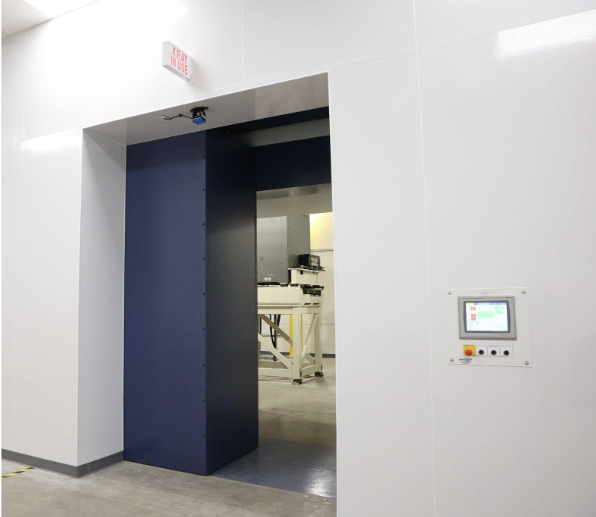 Sliding radiation shielding door system